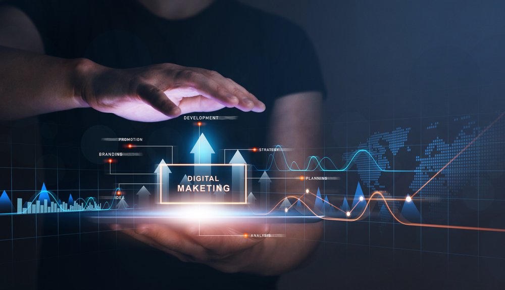 Digital marketing importance concept. Businessman holding tablet with analysis a graph growth.